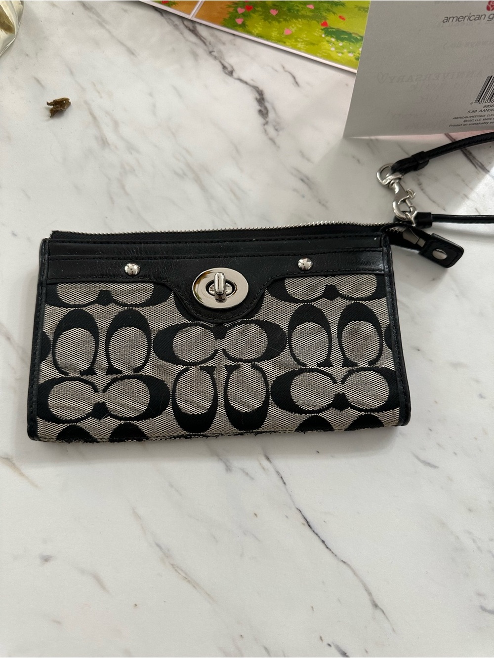 Coach Penelope Zippy Turnlock
Signature Wristlet Wallet